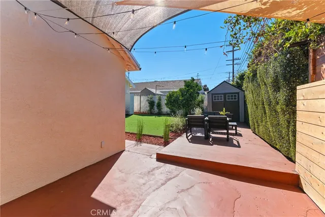 a view of a backyard with sitting area