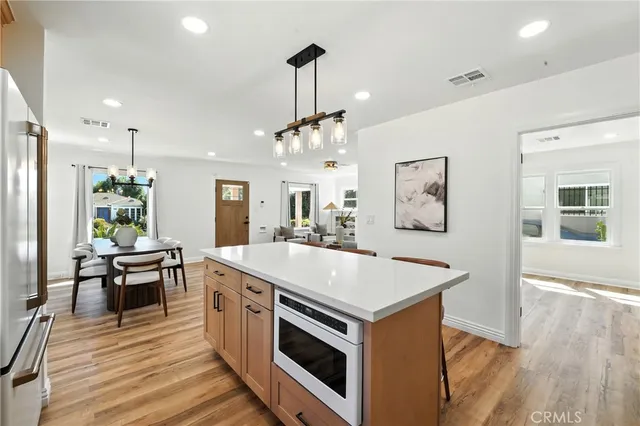 a kitchen that has a stove and a table