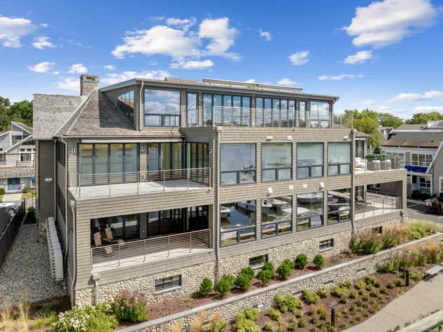 a view of a house with backyard porch and sitting area