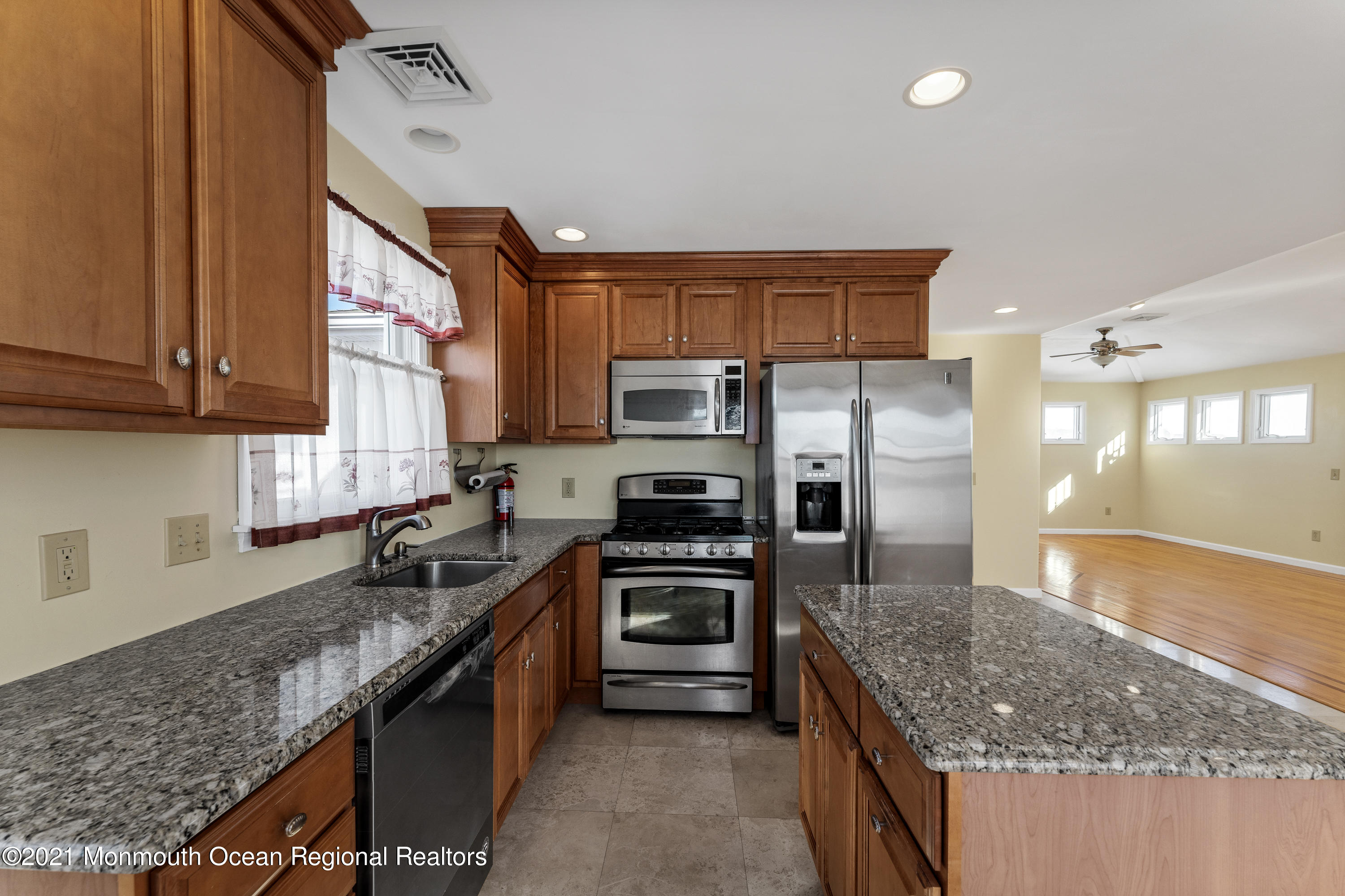 303 Heron Road Tuckerton, NJ 08087 - Photo 23 of 58 a kitchen with stainless steel appliances granite countertop a sink stove and refrigerator