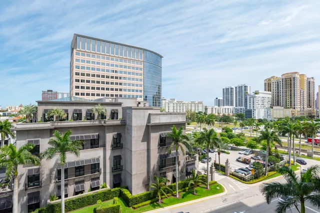 a view of swimming pool with outdoor seating and city view