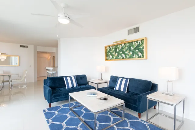 a living room with furniture and a rug