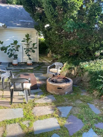 a view of a chairs and table of the house