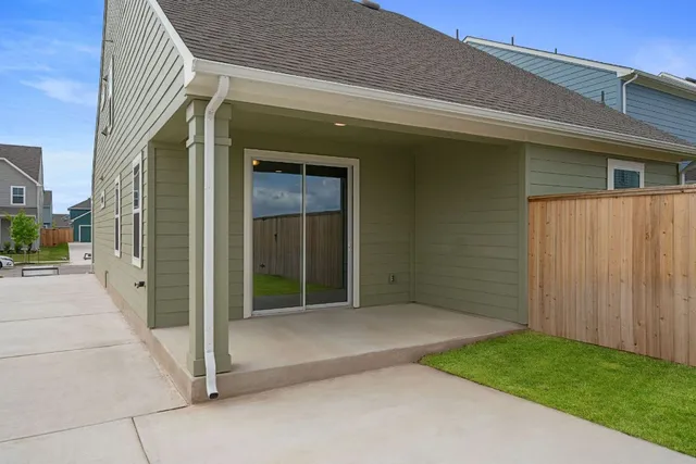 a view of a house with a yard and deck