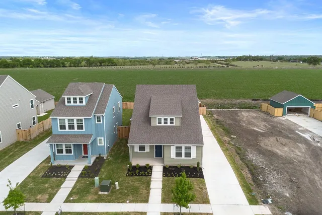 an aerial view of a house with a lake view