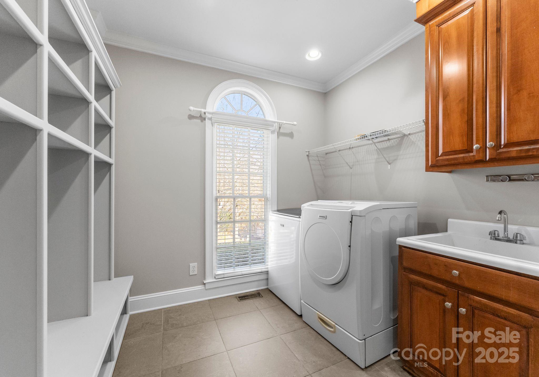 1604 Windy Ridge Road Charlotte, NC 28270 - Photo 18 of 39 a utility room with dryer and washer