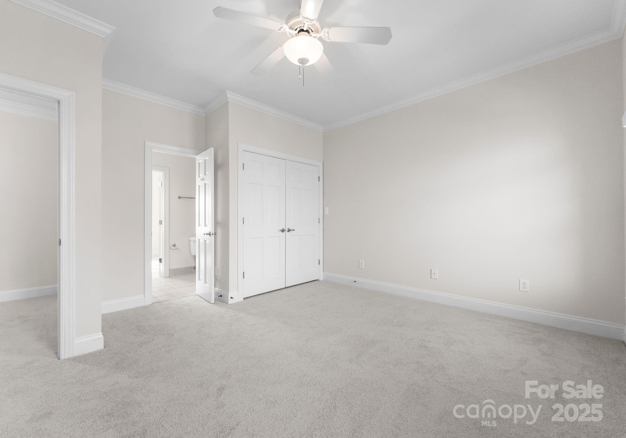 1604 Windy Ridge Road Charlotte, NC 28270 - Photo 19 of 39 a view of an empty room and chandelier fan