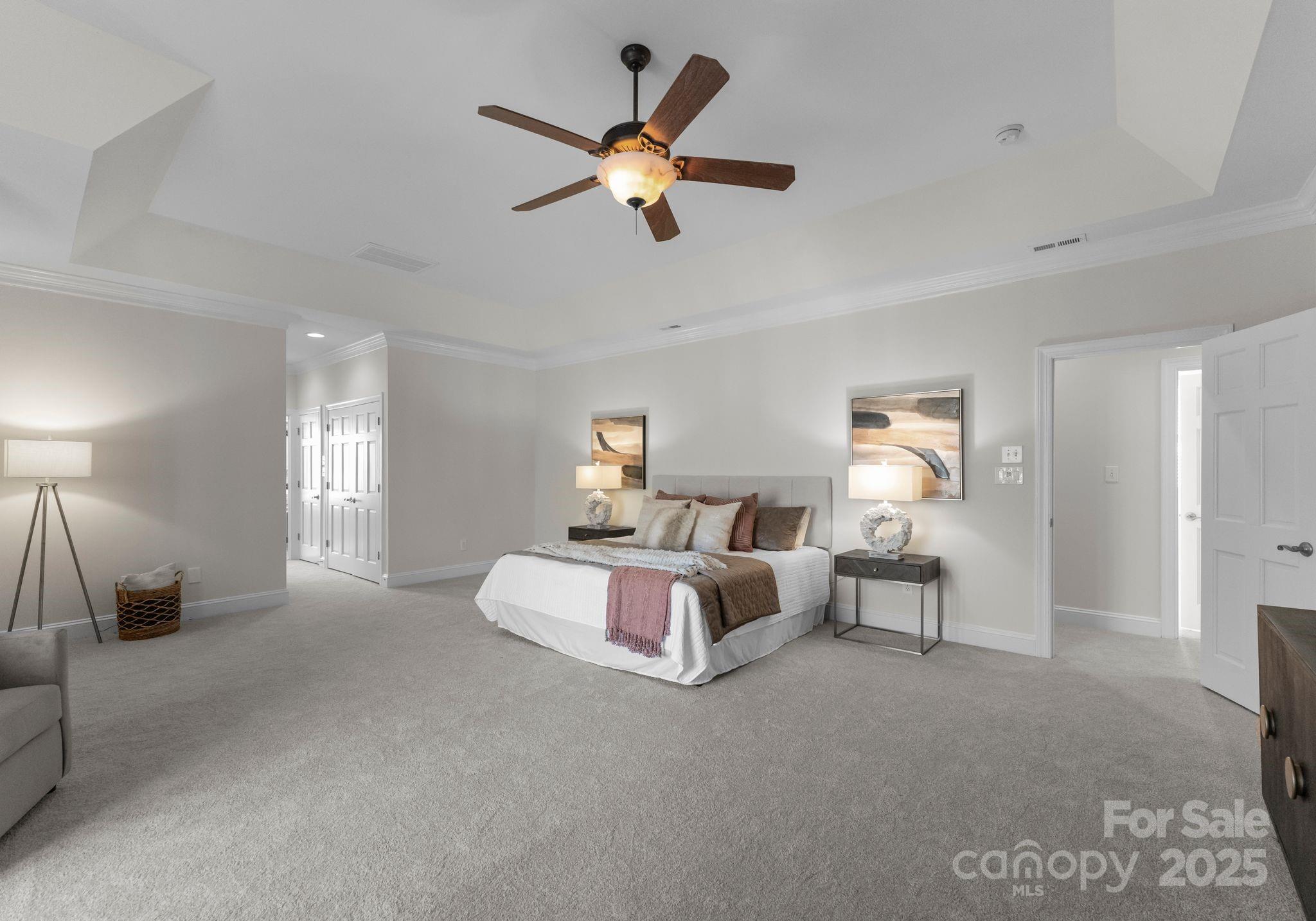 1604 Windy Ridge Road Charlotte, NC 28270 - Photo 24 of 39 a bed room with bed and a chandelier