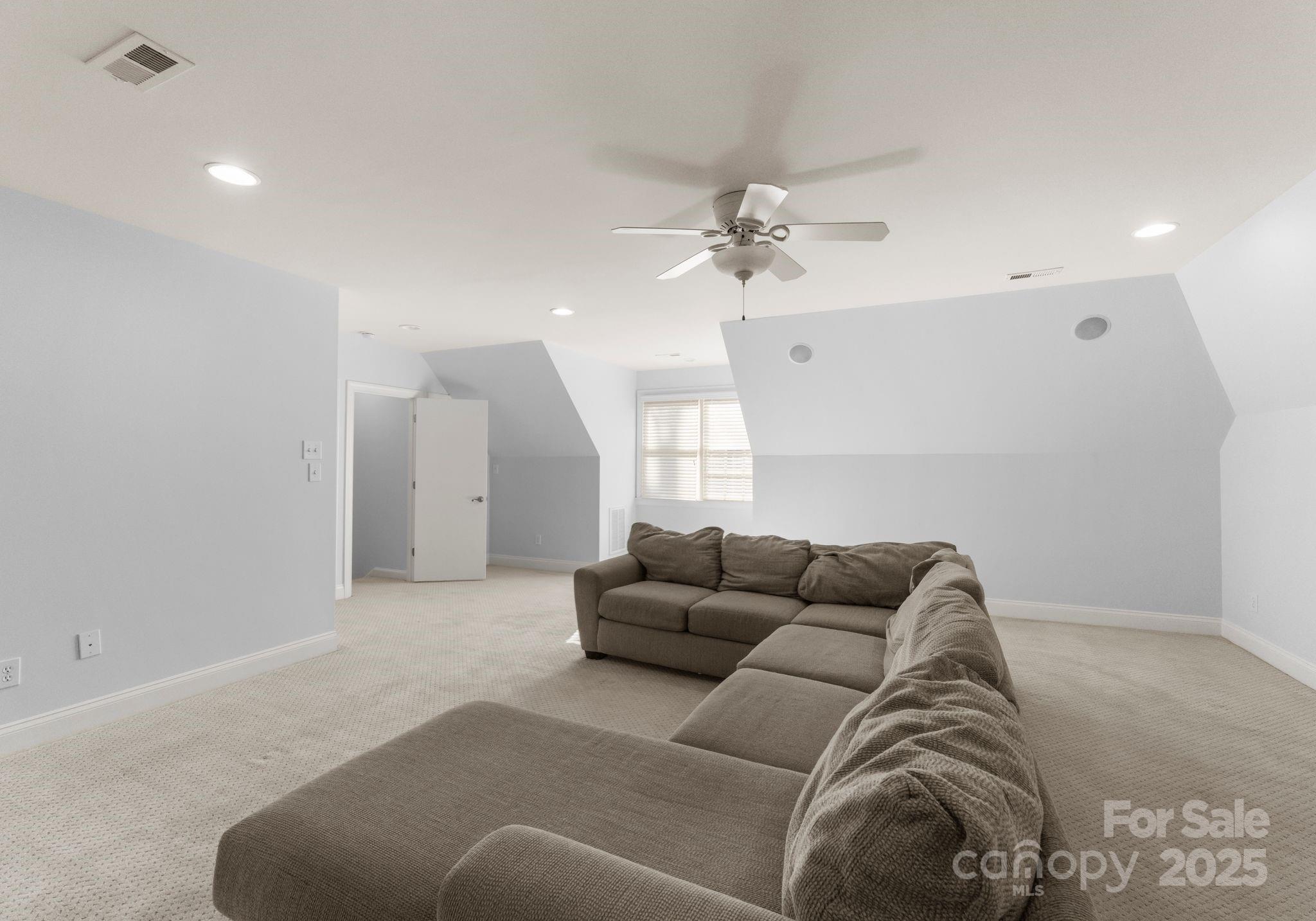 1604 Windy Ridge Road Charlotte, NC 28270 - Photo 32 of 39 a living room with furniture and a couch