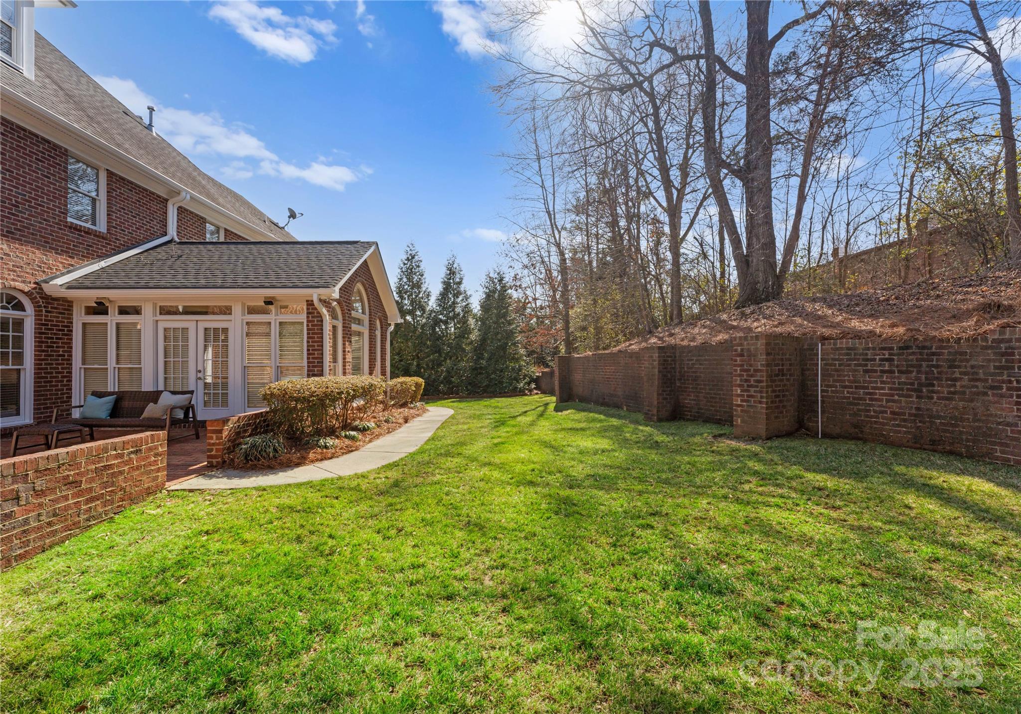 1604 Windy Ridge Road Charlotte, NC 28270 - Photo 38 of 39 a view of a house with backyard and sitting area