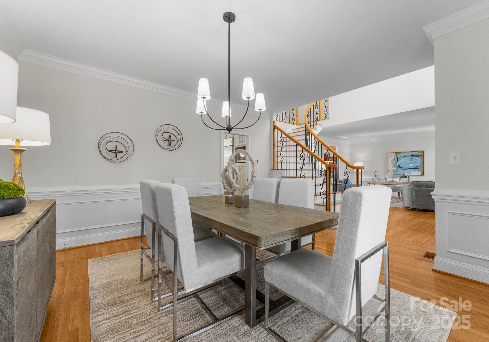 1604 Windy Ridge Road Charlotte, NC 28270 - Photo 9 of 39 a view of a dining room with furniture and wooden floor