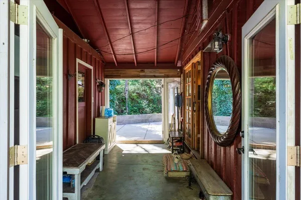 a view of a porch with a floor to ceiling window