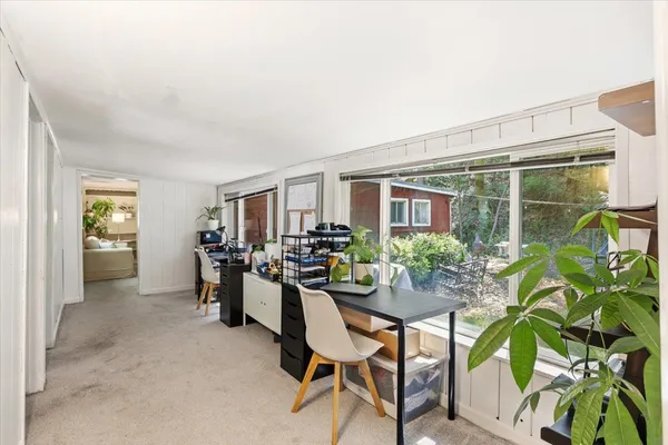 a view of a dining room with furniture window and outside view