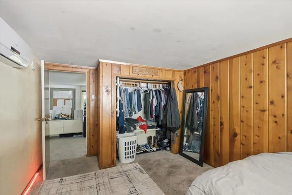 a view of a bedroom with walk in closet