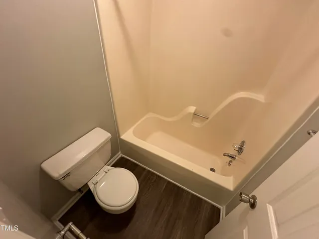 a bathroom with a toilet and a sink