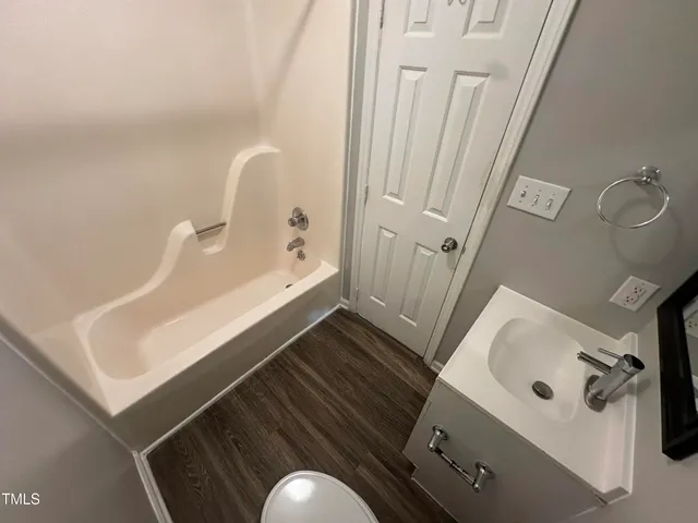a bathroom with a sink and mirror