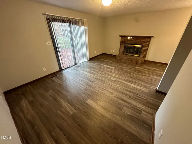 a view of a livingroom with wooden floor