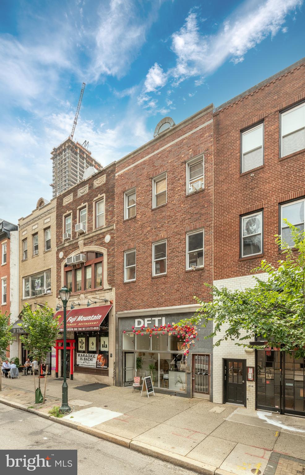 a front view of a building with street view