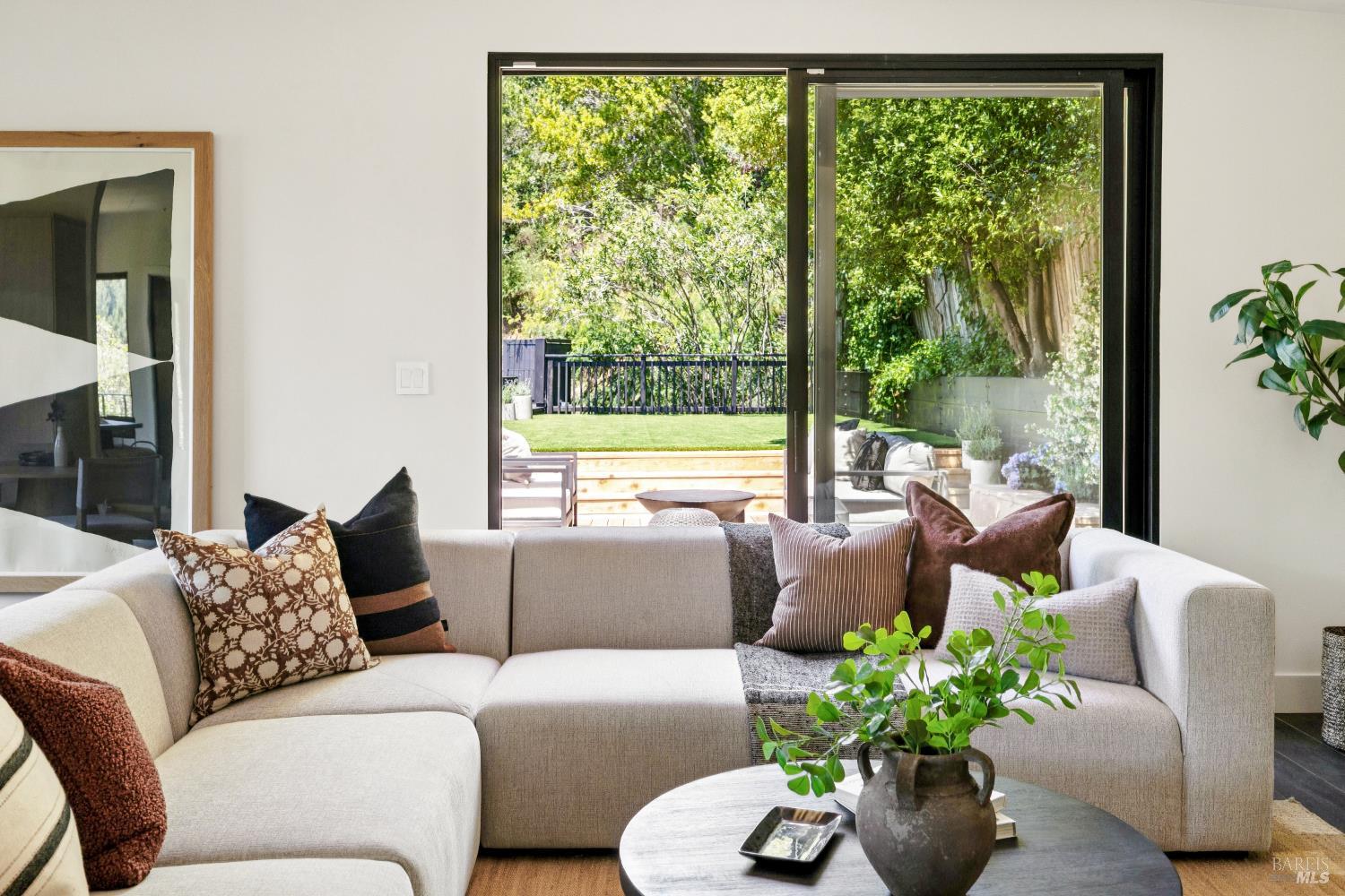 56 Millard Road Larkspur, CA 94939 - Photo 18 of 74 a living room with patio furniture and a potted plant