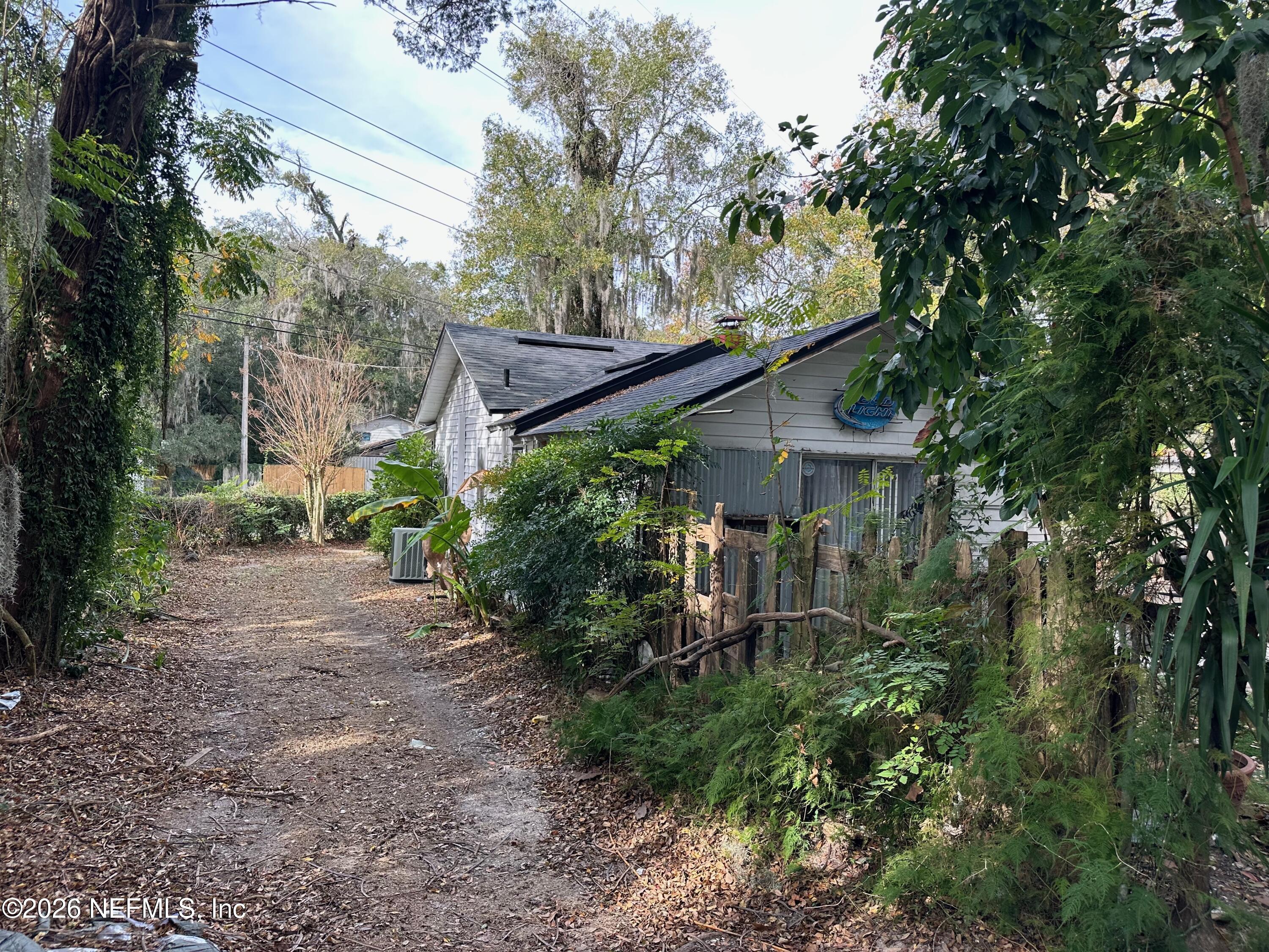 421 Arlington Road North Jacksonville, FL 32211 - Photo 11 of 25 a backyard of a house with lots of green space