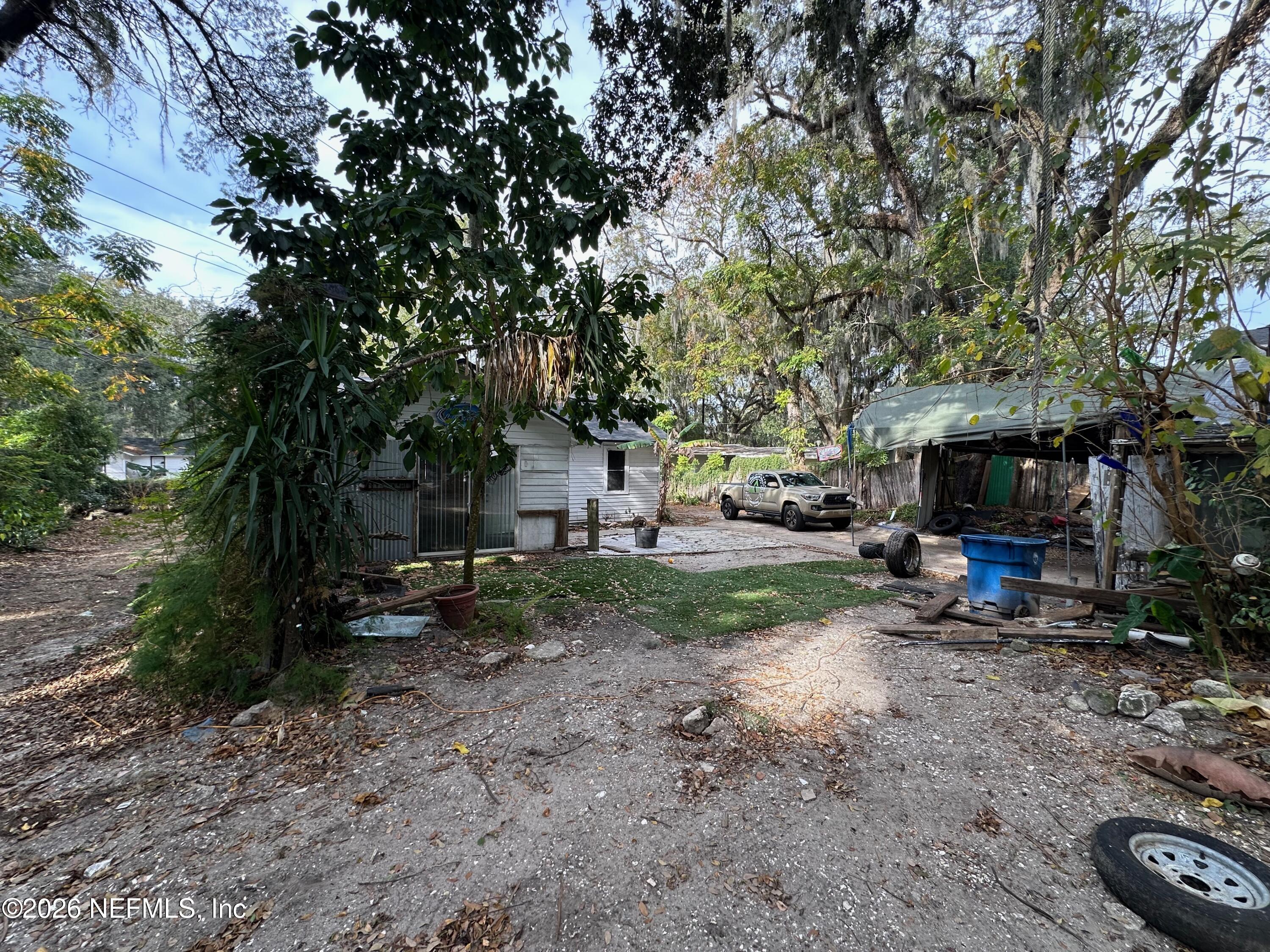 421 Arlington Road North Jacksonville, FL 32211 - Photo 13 of 25 a view of a fire pit in a backyard