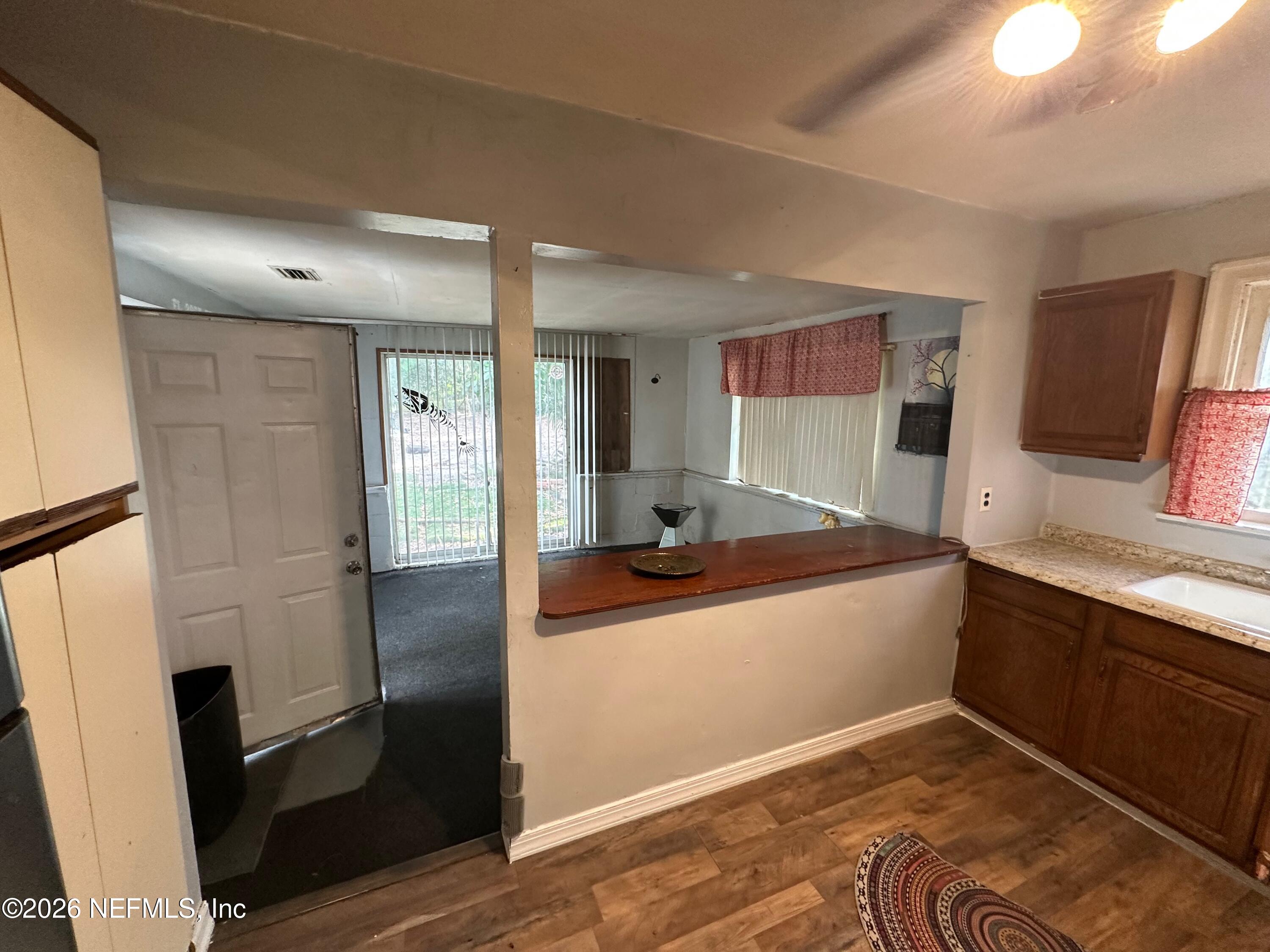 421 Arlington Road North Jacksonville, FL 32211 - Photo 19 of 25 a kitchen with stainless steel appliances granite countertop a refrigerator and a sink