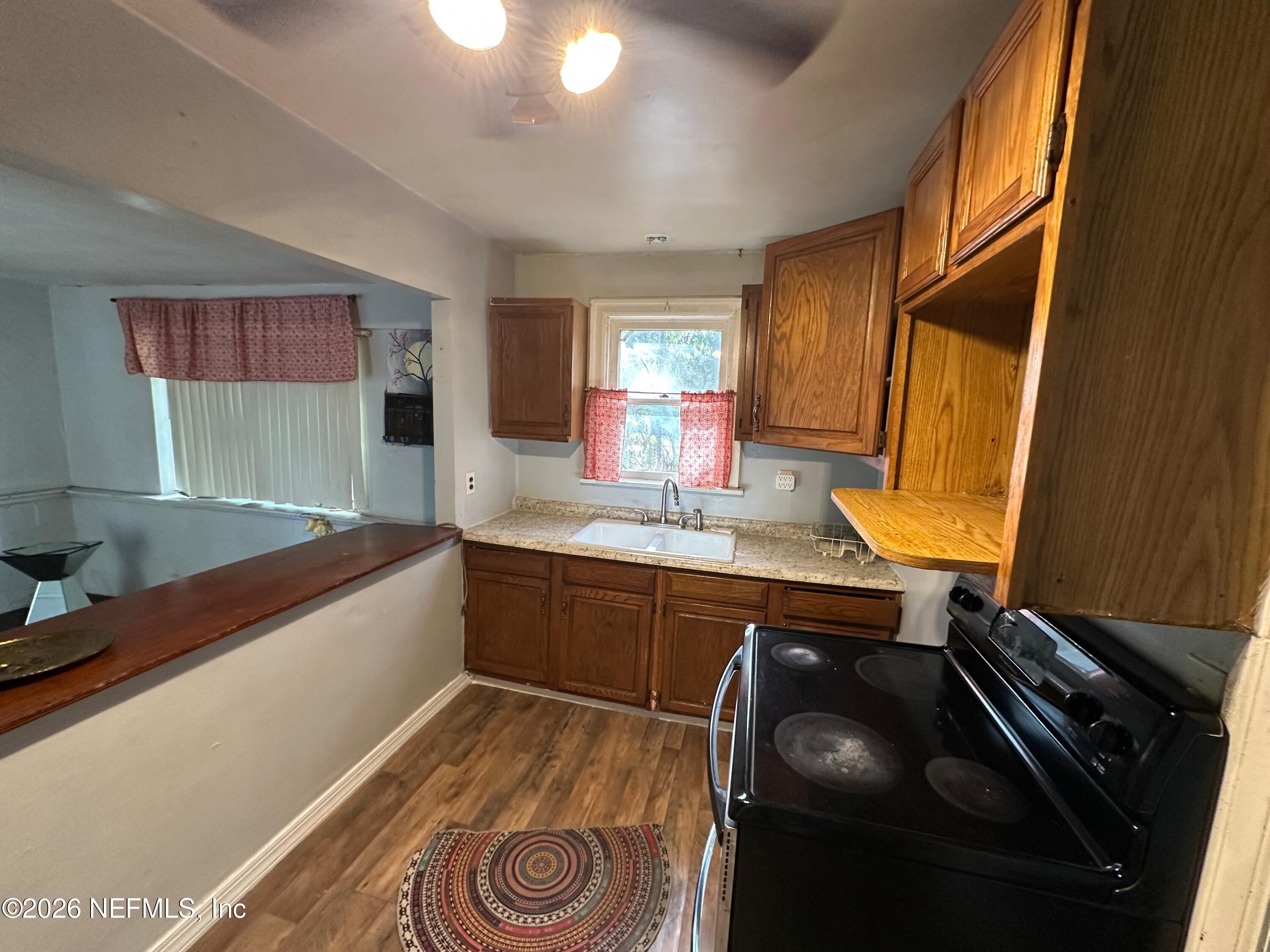 421 Arlington Road North Jacksonville, FL 32211 - Photo 20 of 25 a kitchen with a sink and a stove top oven