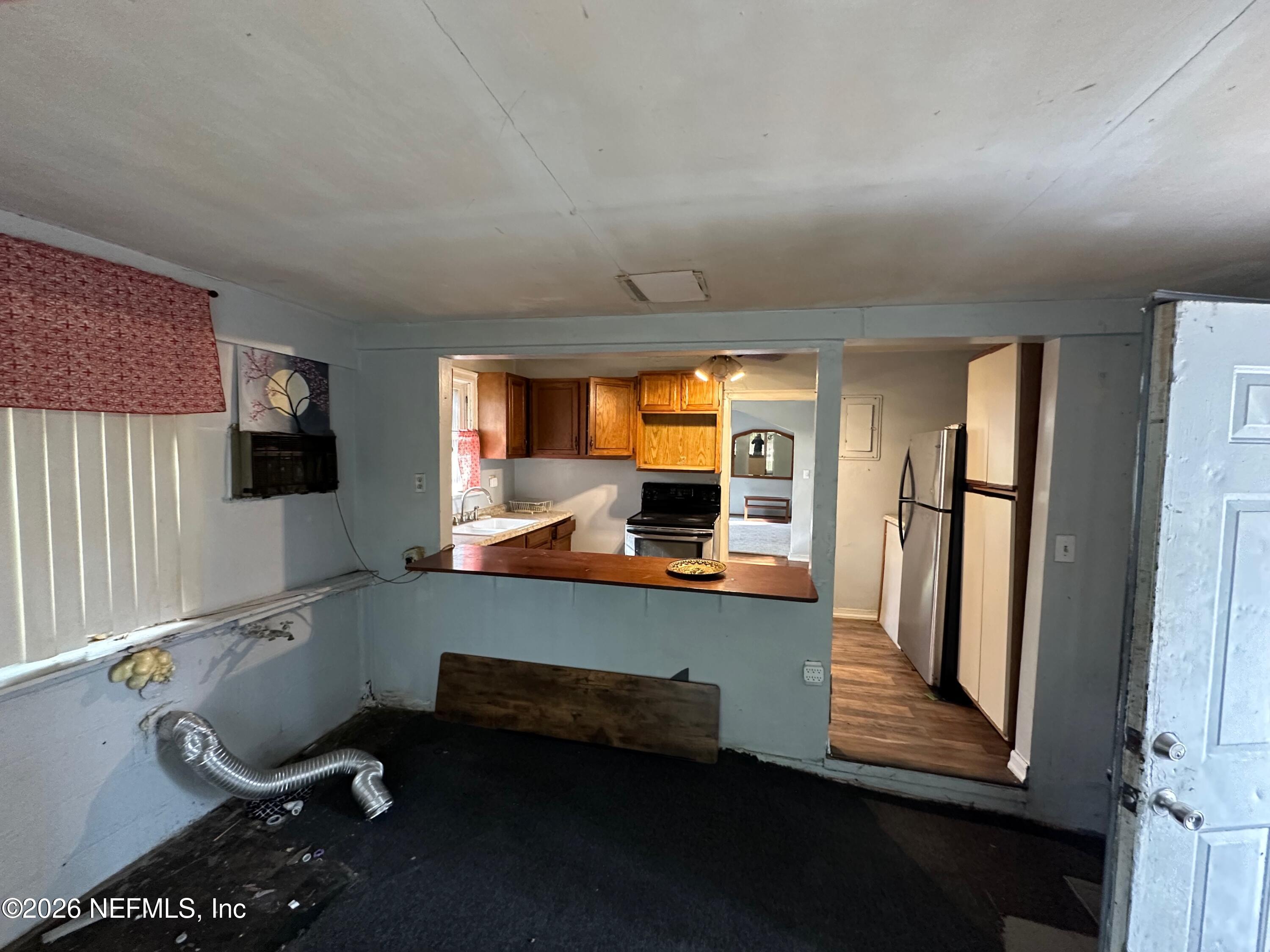 421 Arlington Road North Jacksonville, FL 32211 - Photo 21 of 25 a room with wooden floor and furniture