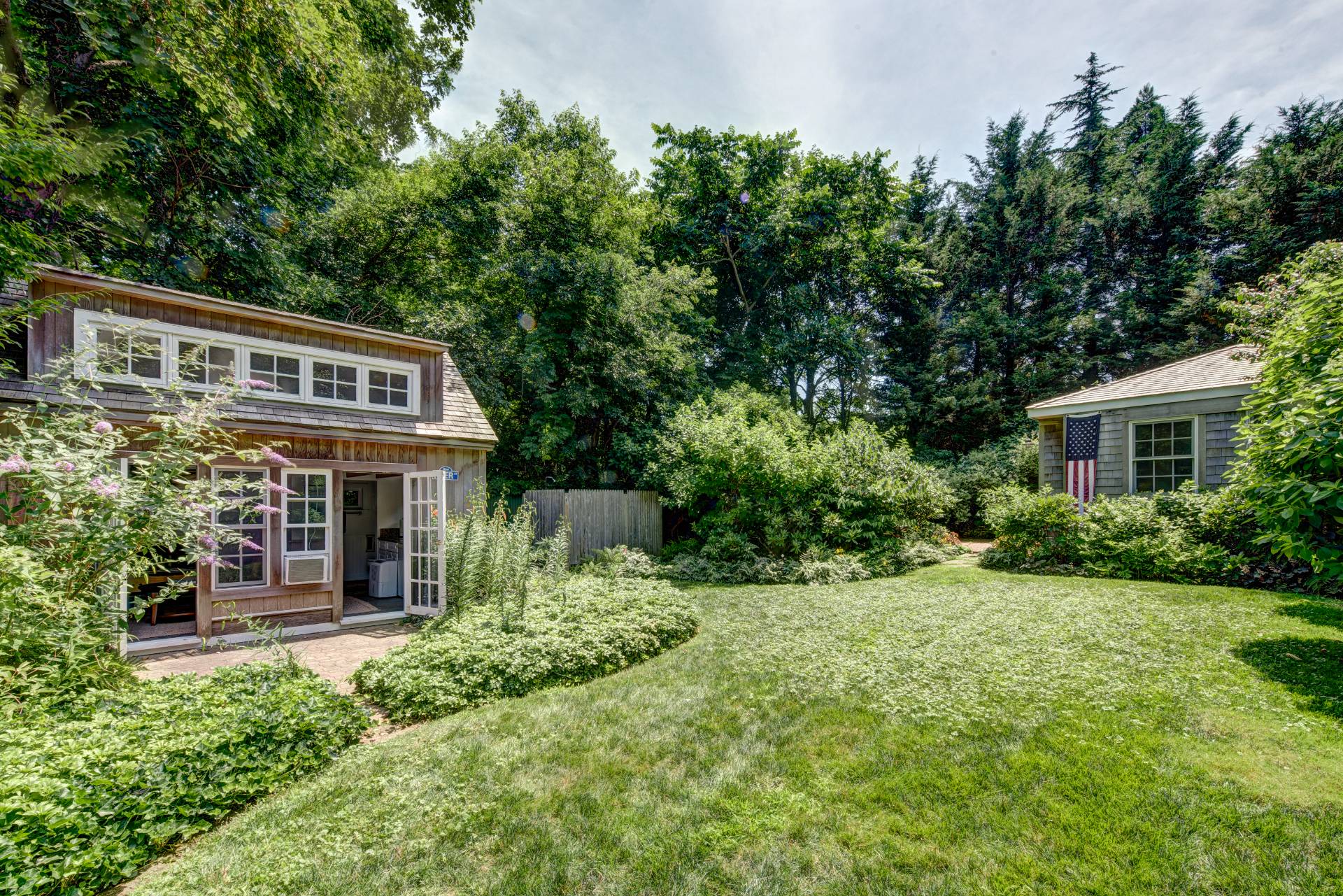 151 Church Lane Bridgehampton, NY 11932 - Photo 13 of 20 a front view of house with yard and green space