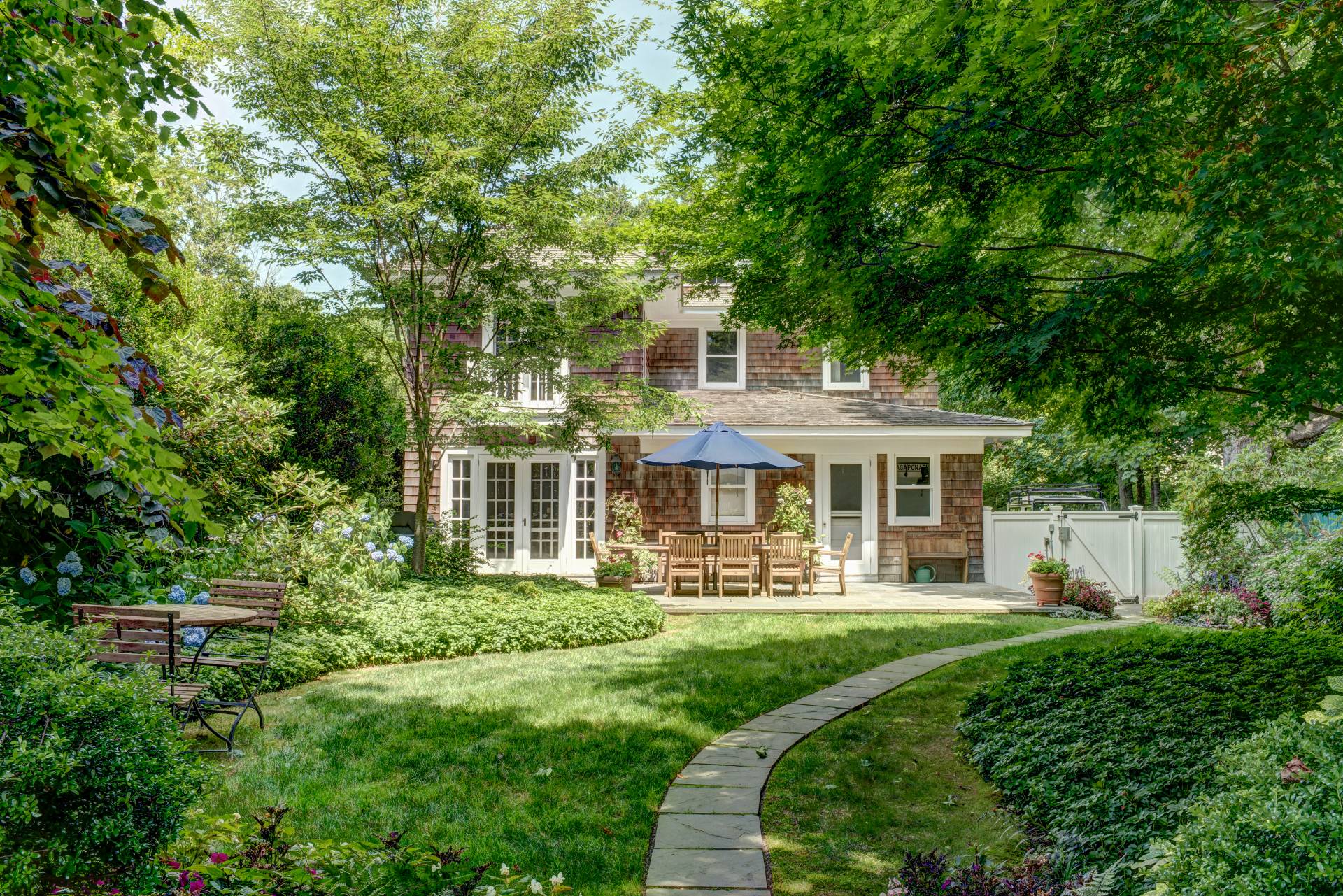 151 Church Lane Bridgehampton, NY 11932 - Photo 18 of 20 a front view of a house with a yard
