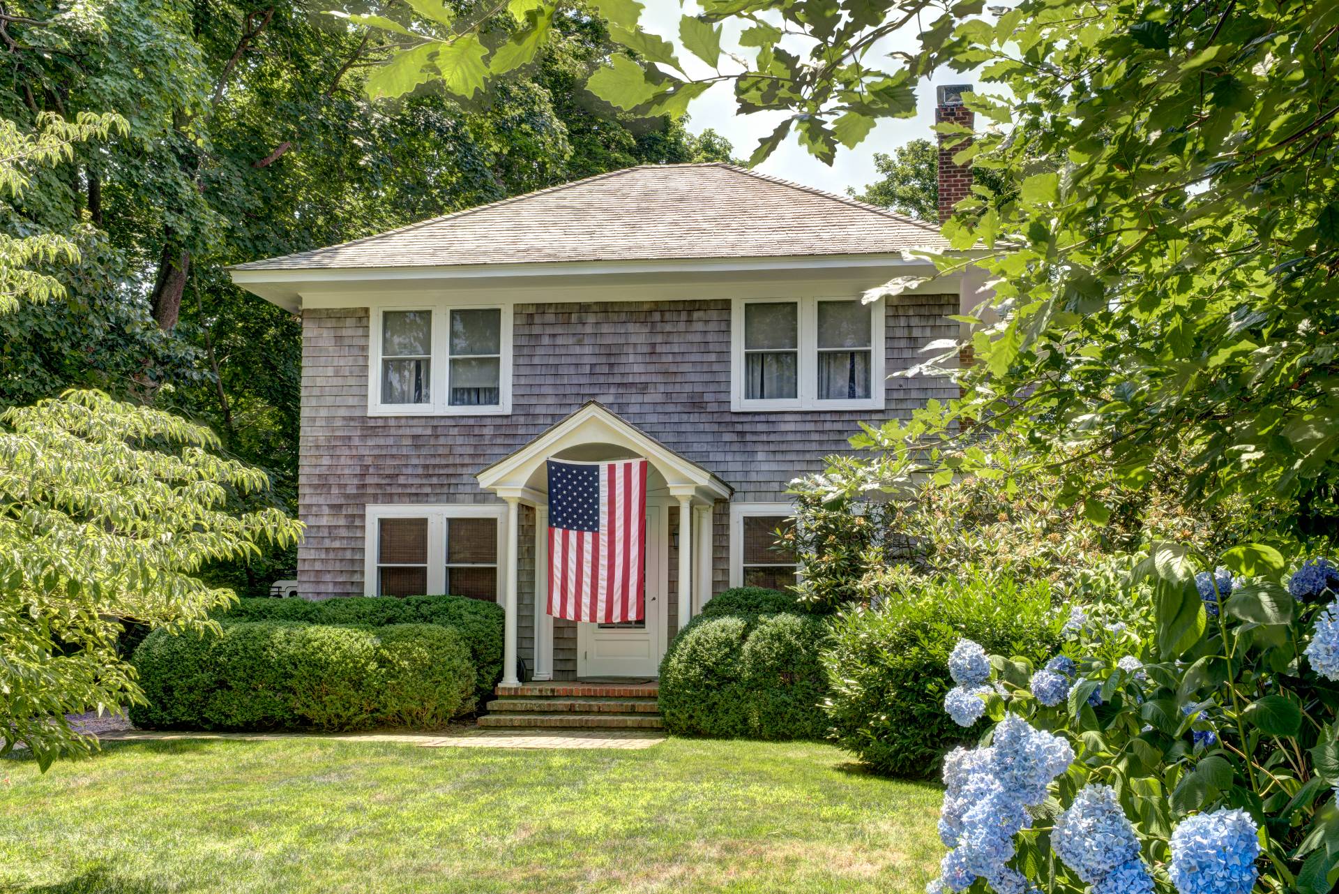 151 Church Lane Bridgehampton, NY 11932 - Photo 2 of 20 a front view of a house with a yard