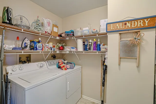 a utility room with washer and dryer