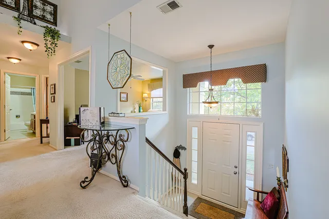 a view of a livingroom with furniture and a window