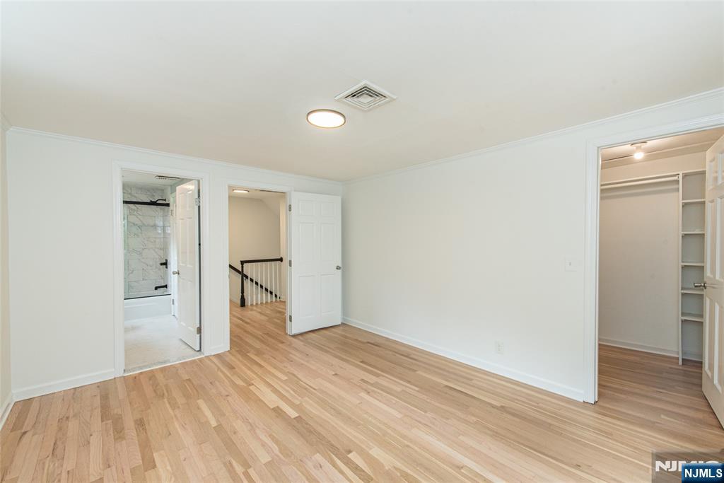 163 Sand Spring Road Morristown, NJ 07960 - Photo 23 of 39 a view of empty room with wooden floor