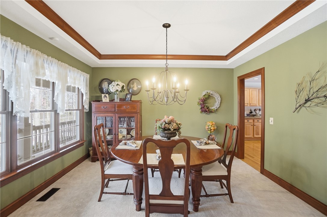 5300 Brookshire Lane Springfield, OH 45502 - Photo 23 of 56 This inviting dining area features a tray ceiling, creating a refined atmosphere for memorable meals.