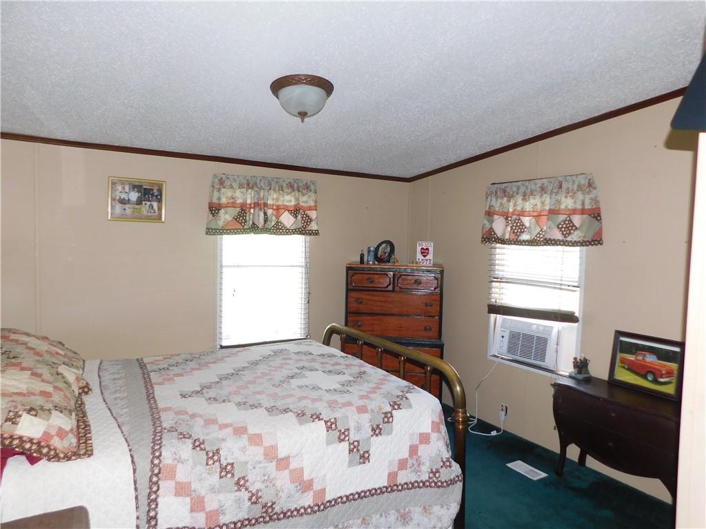 1199 Banning Road Dawson, PA 15428 - Photo 18 of 24 a bedroom with a bed and window