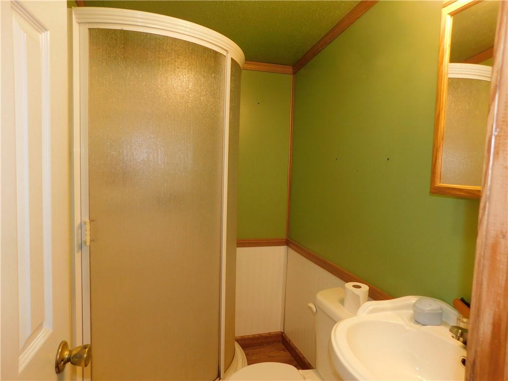 1199 Banning Road Dawson, PA 15428 - Photo 20 of 24 a bathroom with a sink and mirror