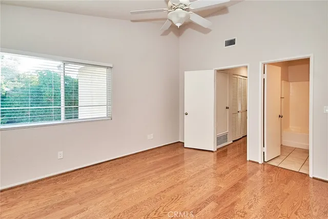 a bathroom with a sink toilet vanity and shower