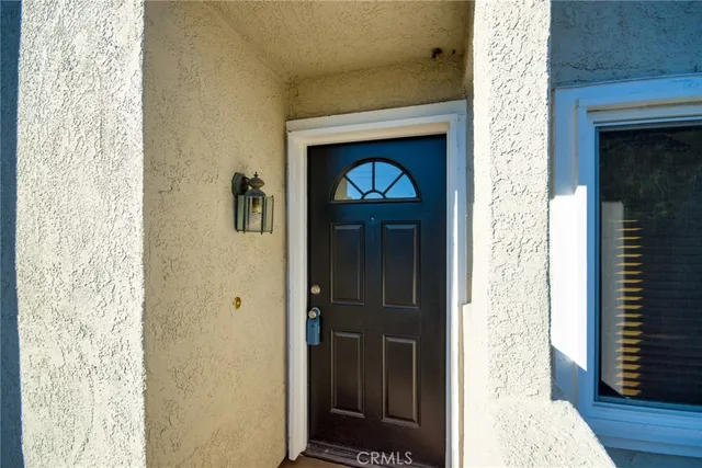 a view of a hallway with wooden floor and a hallway