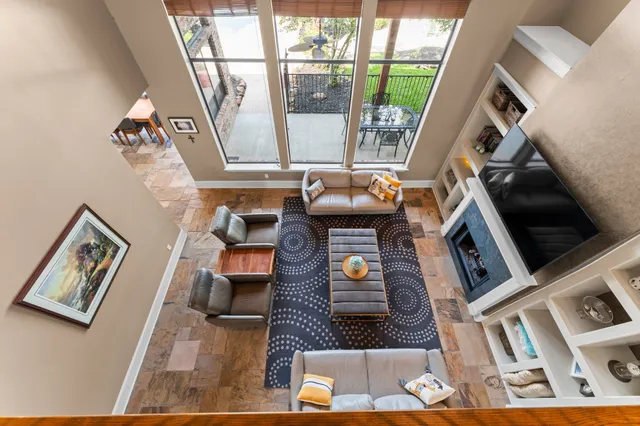 a living room with furniture and a large window