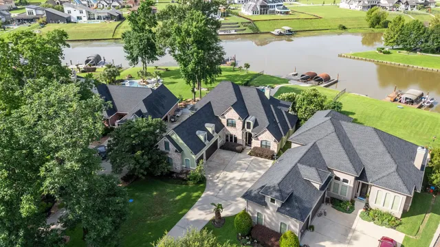 an aerial view of house with yard swimming pool and outdoor seating