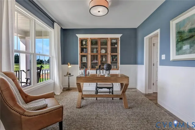 a dining room with furniture and window