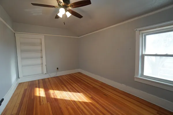 a bathroom with a toilet and a shower curtain