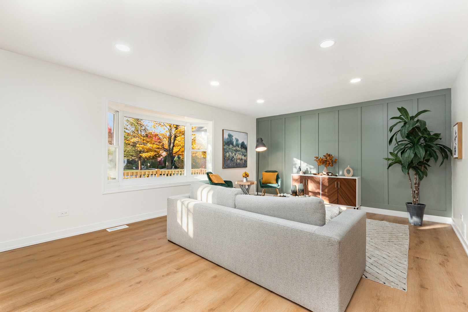 11426 Kluth Drive Mokena, IL 60448 - Photo 16 of 39 a living room with furniture a potted plant and a large window