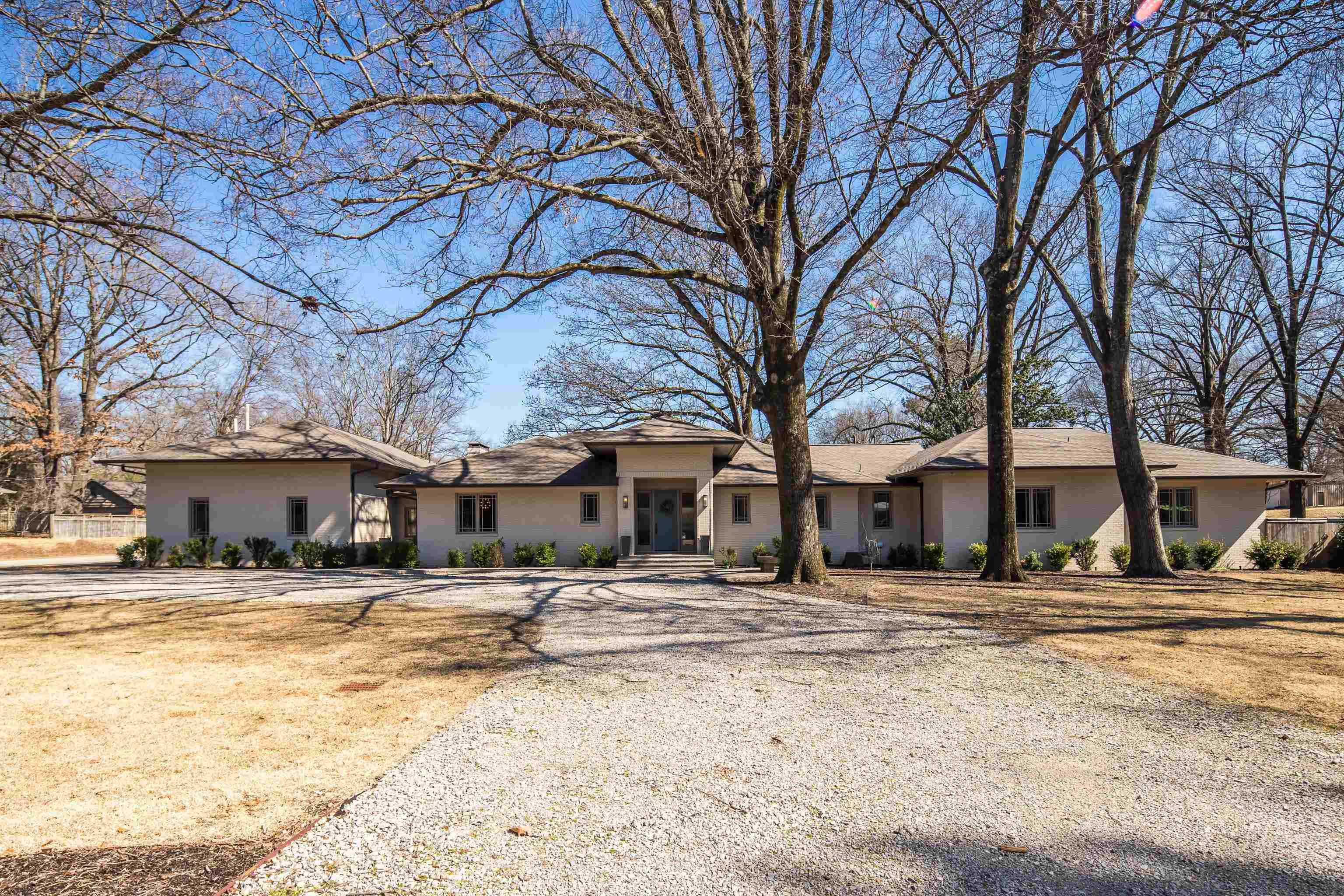 a wooden bench sitting in middle of a yard