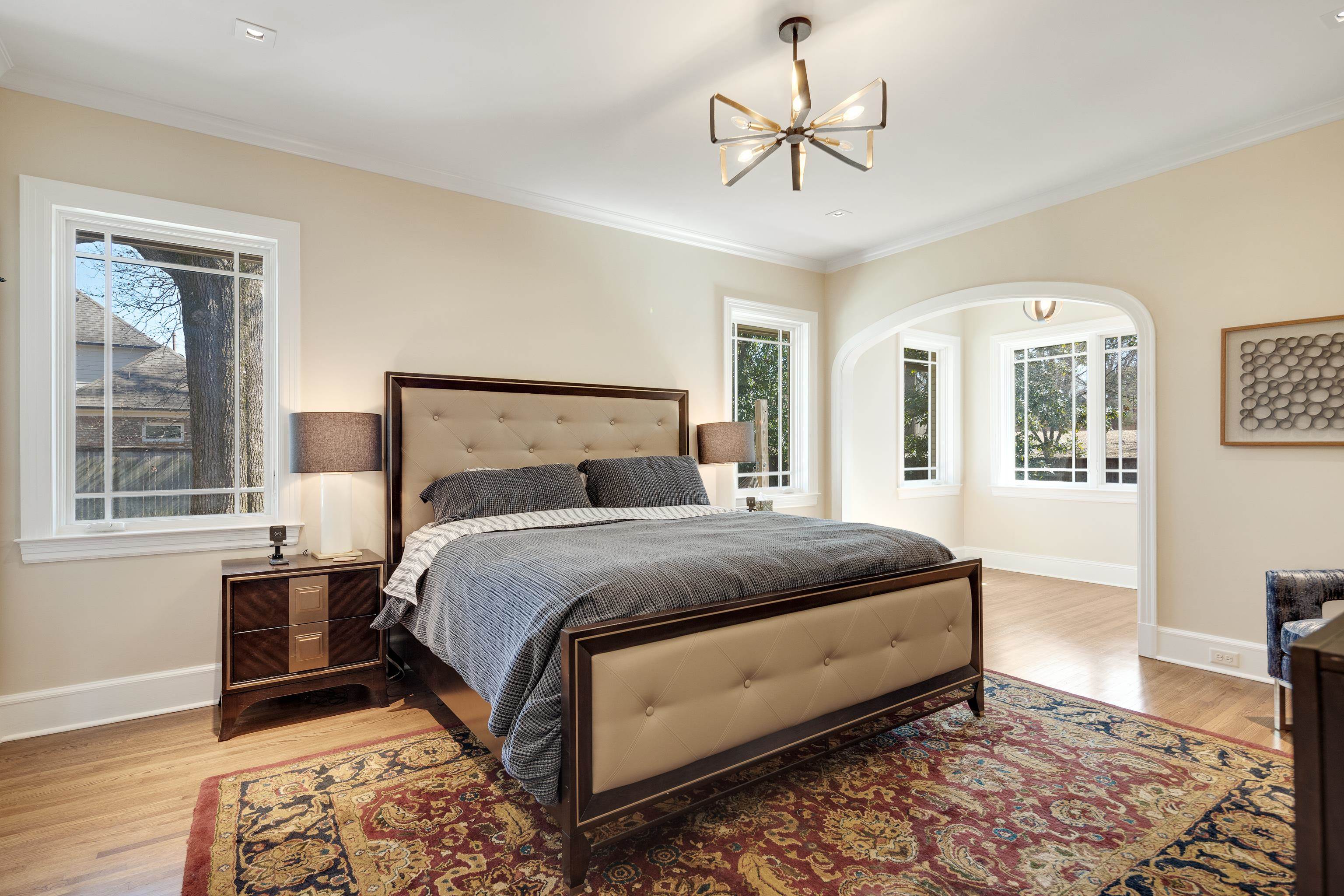 90 North Perkins Road Memphis, TN 38117 - Photo 12 of 25 a bedroom with a bed and wooden floor