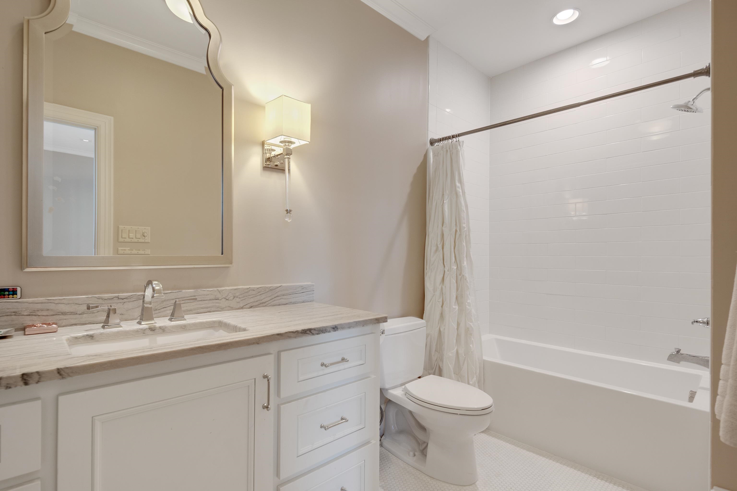 90 North Perkins Road Memphis, TN 38117 - Photo 19 of 25 a bathroom with a sink a toilet and shower