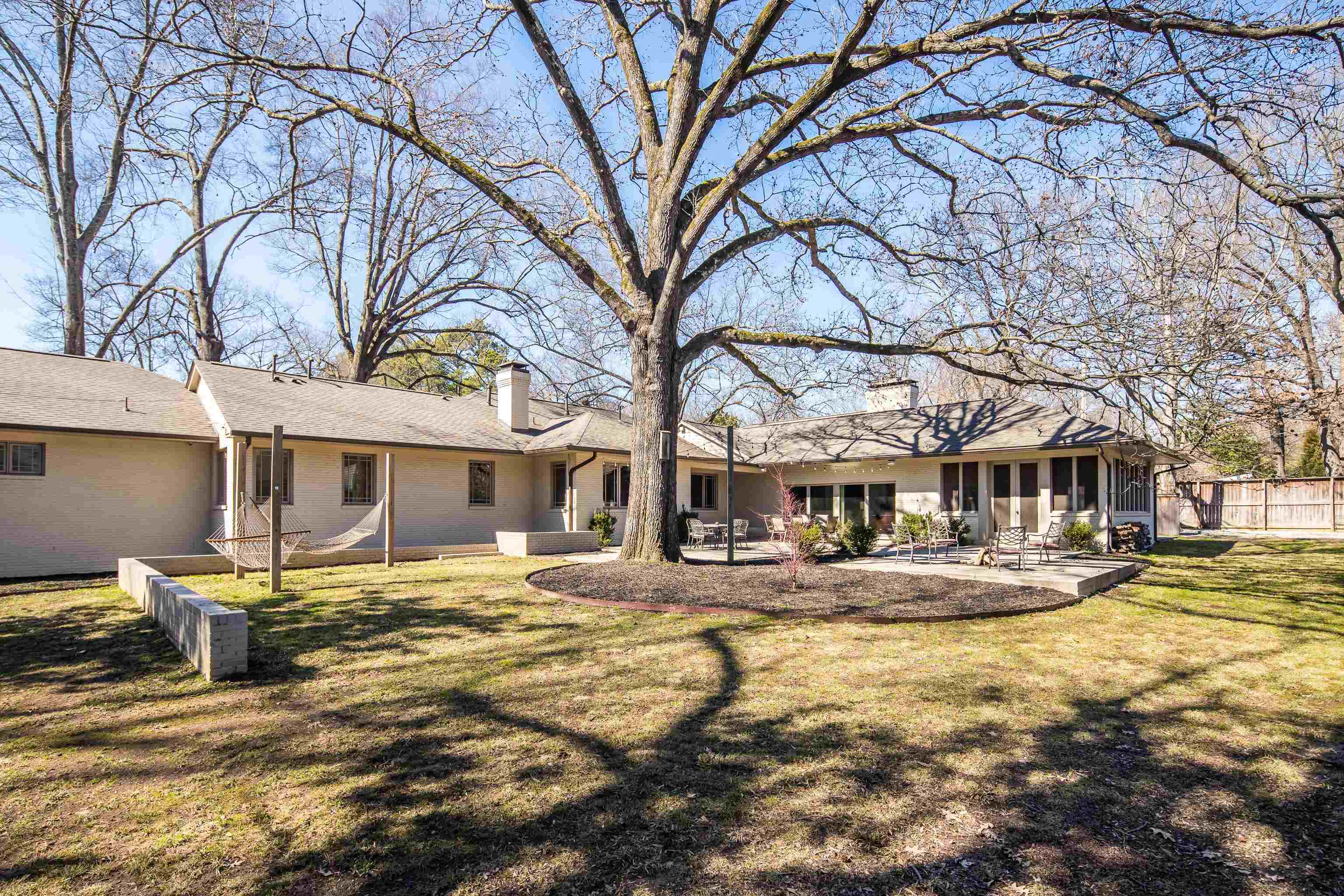 90 North Perkins Road Memphis, TN 38117 - Photo 25 of 25 a front view of a house with a yard covered with trees