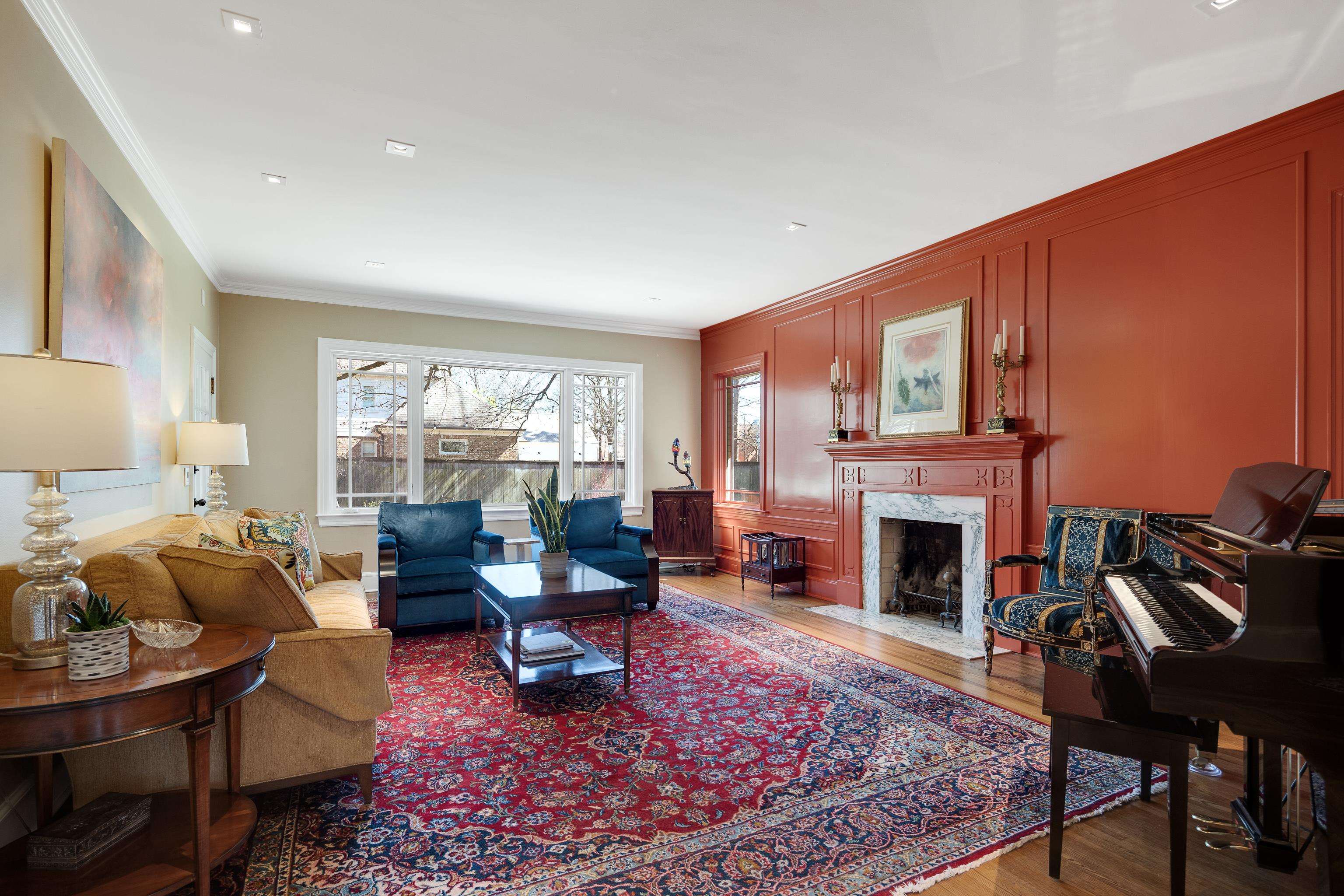 90 North Perkins Road Memphis, TN 38117 - Photo 3 of 25 a living room with furniture a rug a fireplace and a window