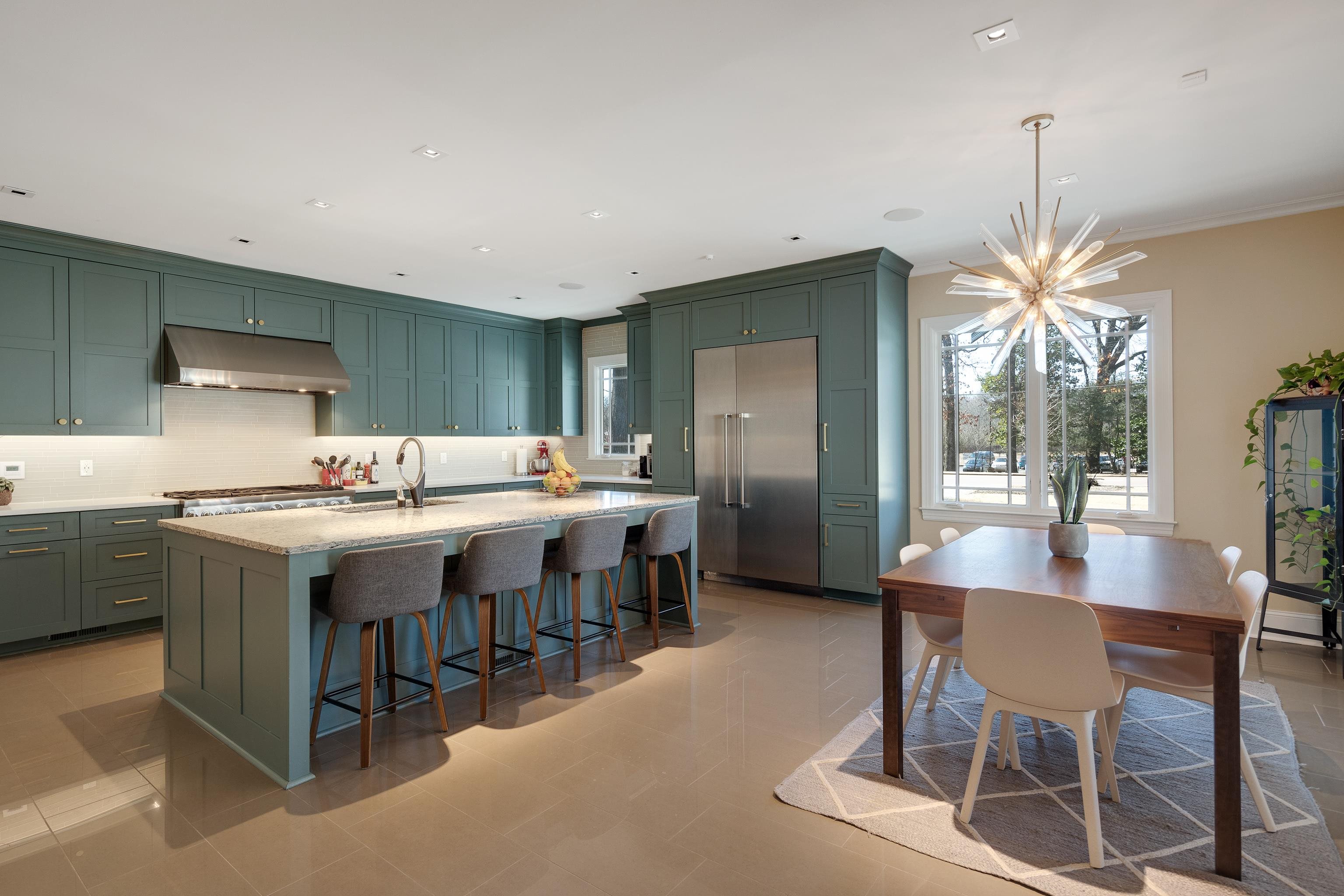 90 North Perkins Road Memphis, TN 38117 - Photo 5 of 25 a kitchen with a dining table chairs sink and cabinets